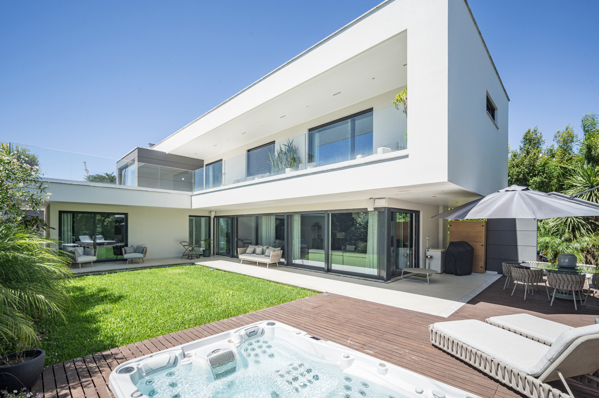 Contemporary villa exterior at dusk in Birre, Cascais